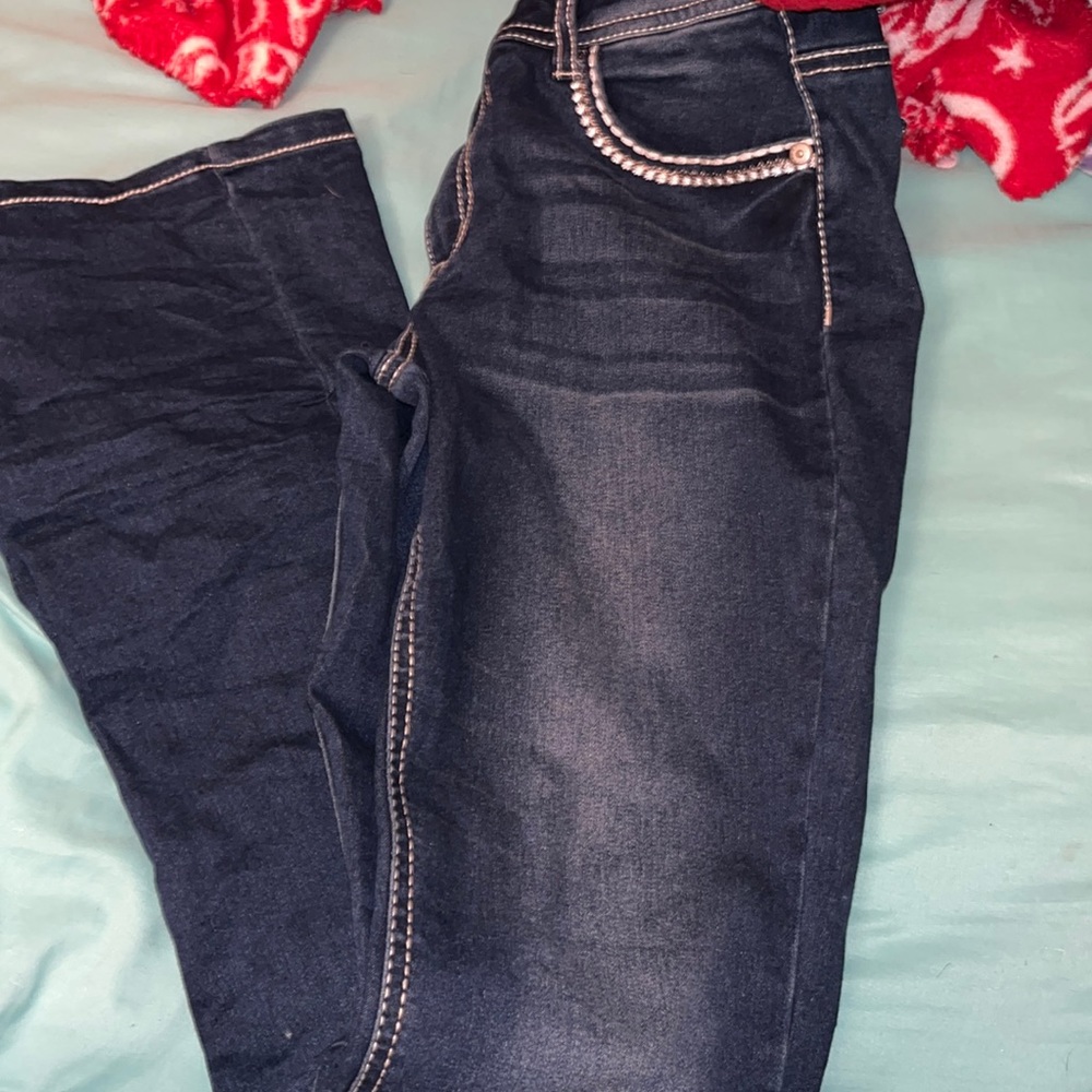 There are two pairs of kids jeans